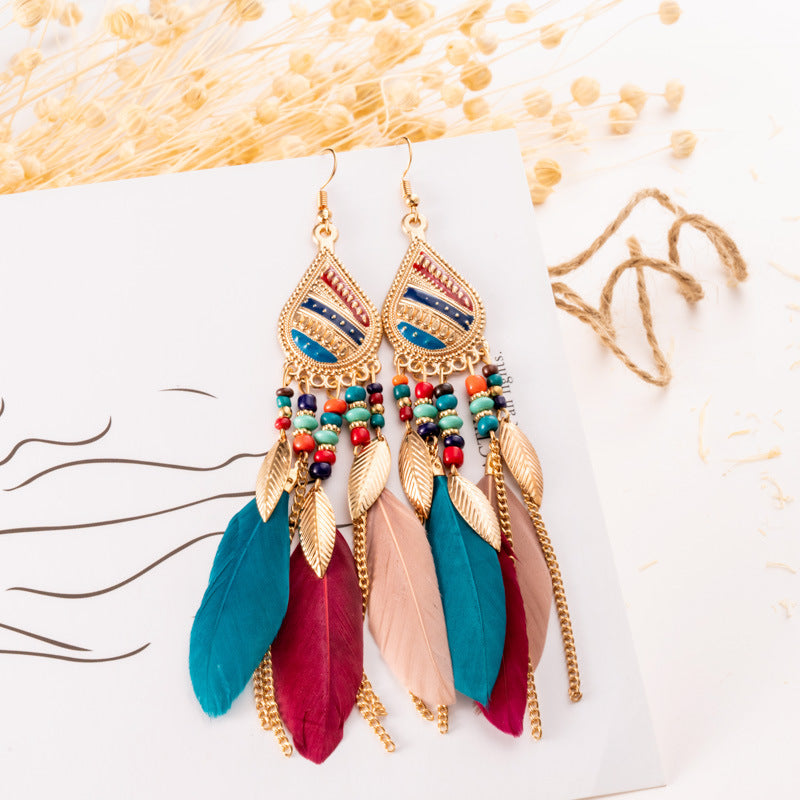 Feather earrings and pearl earrings - SELFTRITSS